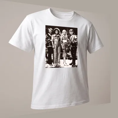 Vintage t-shirt featuring the name ABBA in bold lettering and a retro design — printed on a unisex t-shirt (angled view)