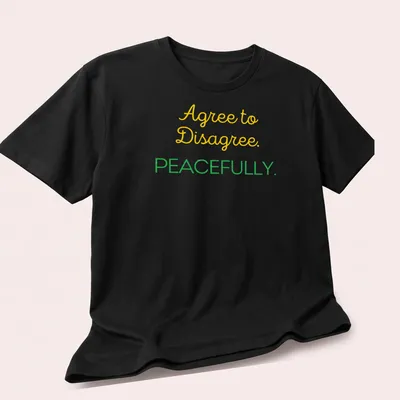 Playful script shirt with Agree to Disagree. PEACEFULLY. text in yellow and green. — printed on a unisex t-shirt (angled view)