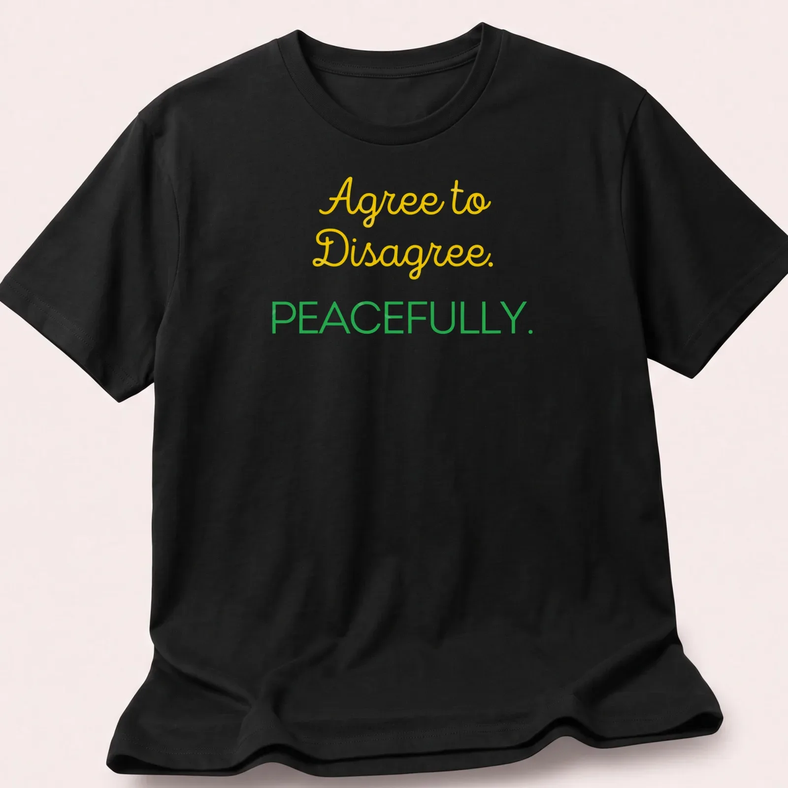Playful script shirt with Agree to Disagree. PEACEFULLY. text in yellow and green. — printed on a unisex t-shirt