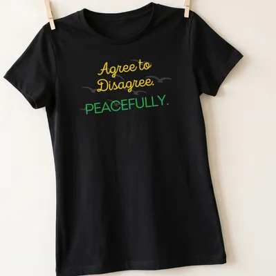 Playful script shirt with Agree to Disagree. PEACEFULLY. text in yellow and green. — printed on a women's shirt