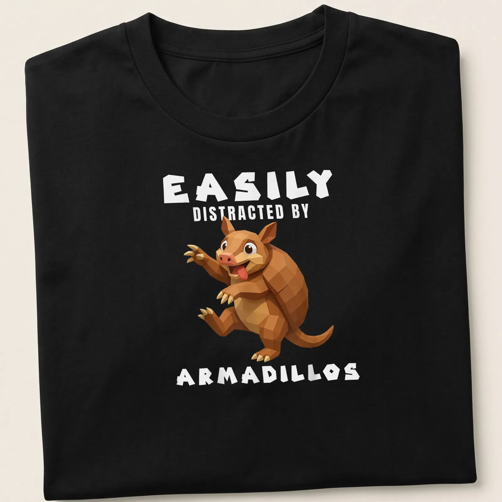 Low poly illustration of an armadillo with the text Easily Distracted By Armadillos — printed on a unisex t-shirt