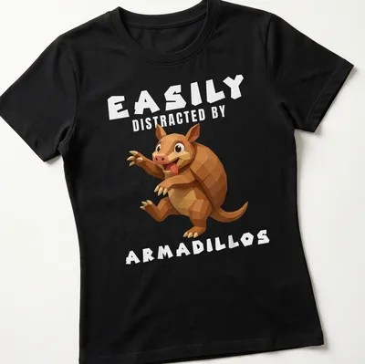 Low poly illustration of an armadillo with the text Easily Distracted By Armadillos — printed on a women's shirt
