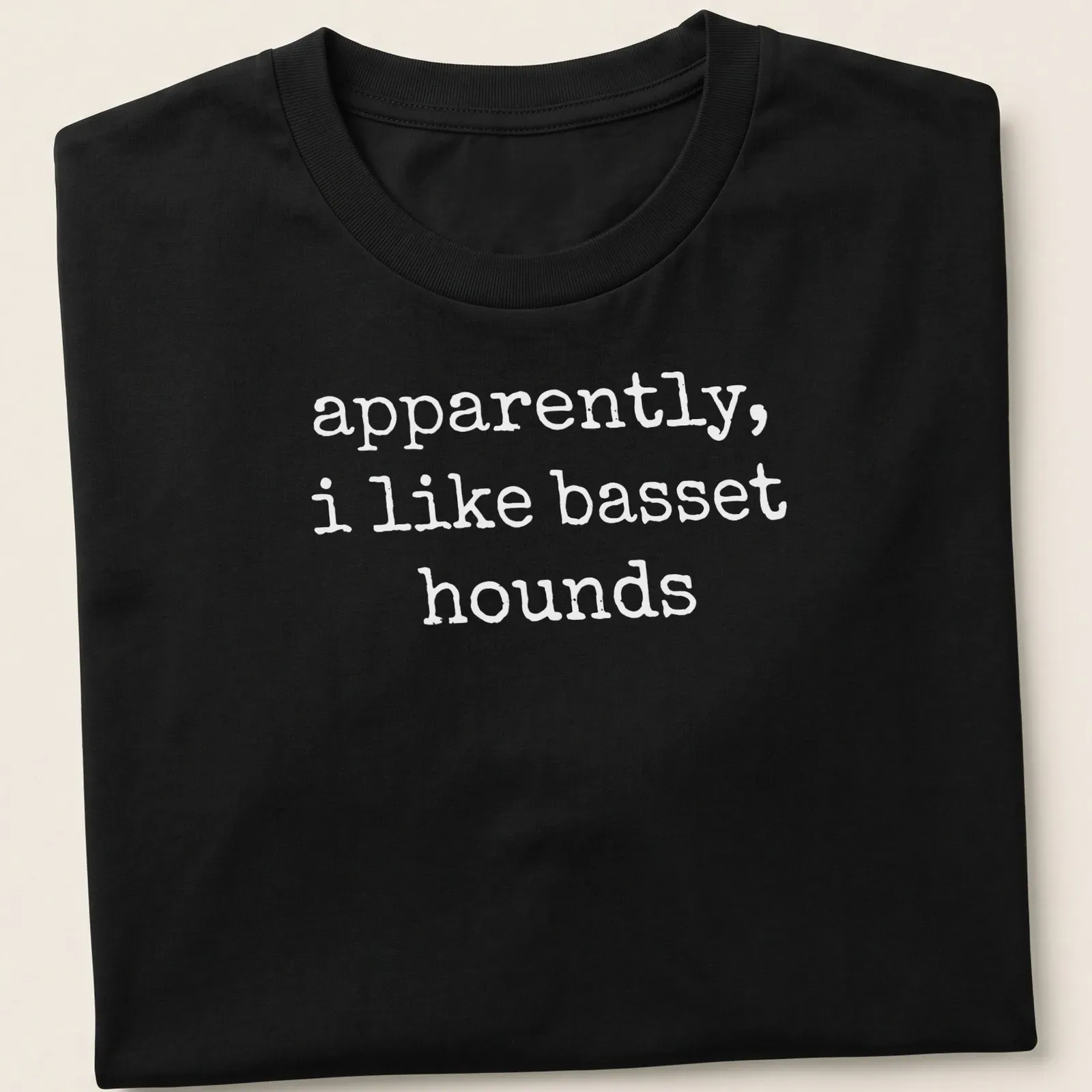 Simple text graphic stating apparently, i like basset hounds on a white — printed on a unisex t-shirt