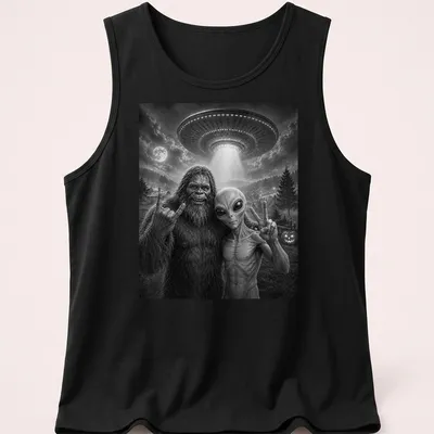 Bigfoot and alien share a selfie with a peace sign in black and white typography — printed on a tank top