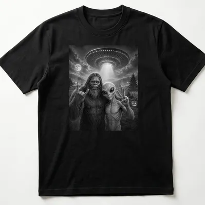 Bigfoot and alien share a selfie with a peace sign in black and white typography