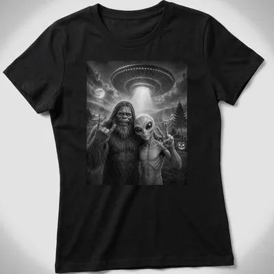 Bigfoot and alien share a selfie with a peace sign in black and white typography — printed on a women's shirt
