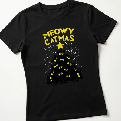 Funny holiday T-shirt featuring black cats around a Christmas tree with text 'Meowy Catmas' — printed on a women's shirt