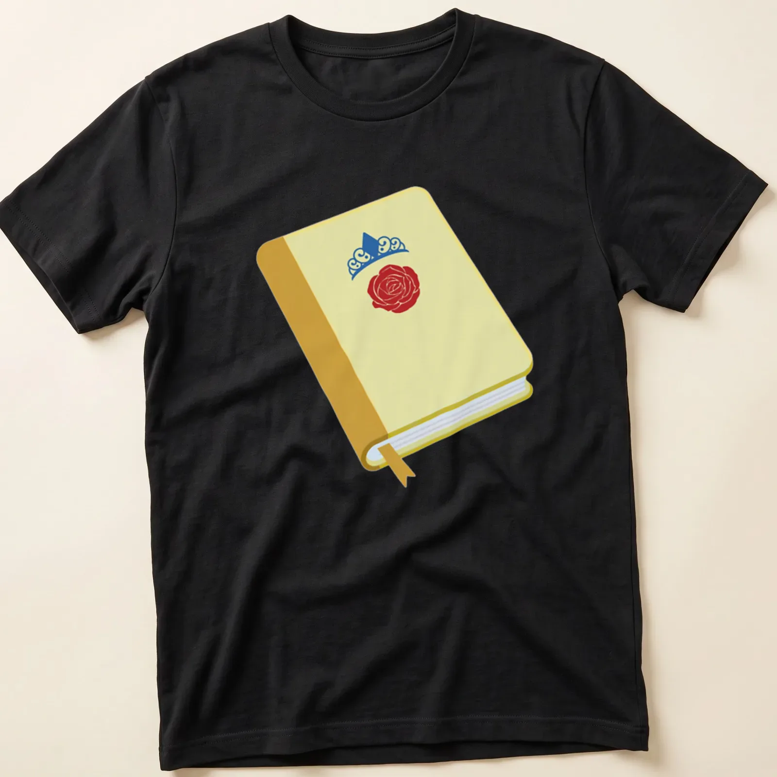 Illustration of an open book with a rose and crown design in bright colors — printed on a unisex t-shirt