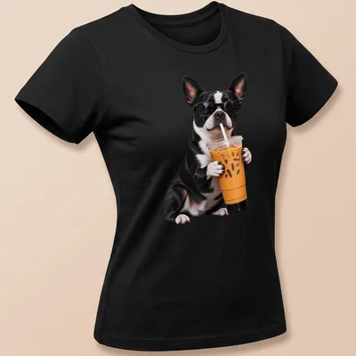 Funny illustration of a Boston Terrier holding iced coffee with a playful expression — printed on a women's shirt