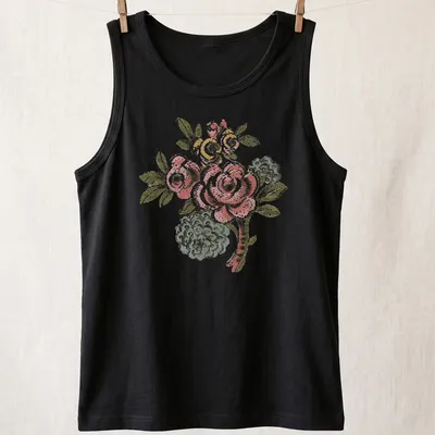 Vintage folk art t-shirt featuring a pink rose bouquet and colorful accents — printed on a tank top