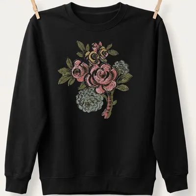 Vintage folk art t-shirt featuring a pink rose bouquet and colorful accents — printed on a unisex sweatshirt