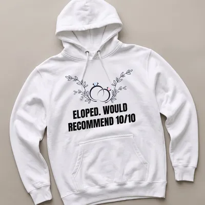 Botanical design featuring wedding rings with the text 'ELOPED. WOULD RECOMMEND 10/10' — printed on a unisex hoodie
