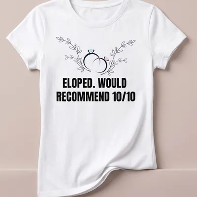 Botanical design featuring wedding rings with the text 'ELOPED. WOULD RECOMMEND 10/10' — printed on a women's shirt
