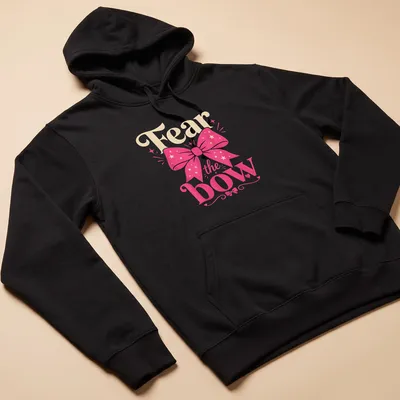 Colorful shirt featuring a playful design with a pink bow and the text 'Fear the bow' in vibrant colors. — printed on a unisex hoodie