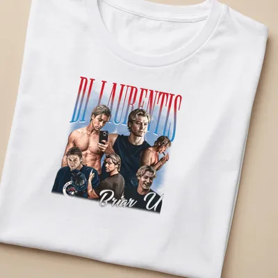 Vintage Dean Di Laurentis shirt with playful illustration and collegiate text. — printed on a women's shirt