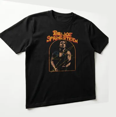 Retro distressed tee featuring Bruce Springsteen's name in bold colors — printed on a unisex t-shirt (angled view)