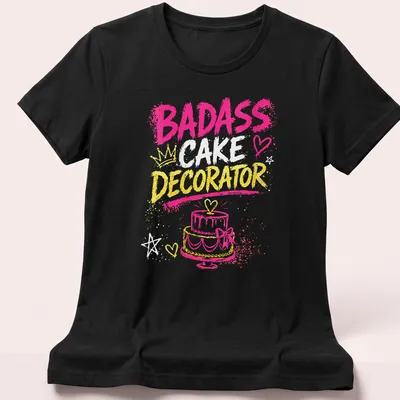 Bold typography shirt celebrating badass cake decorators in bright colors — printed on a women's shirt