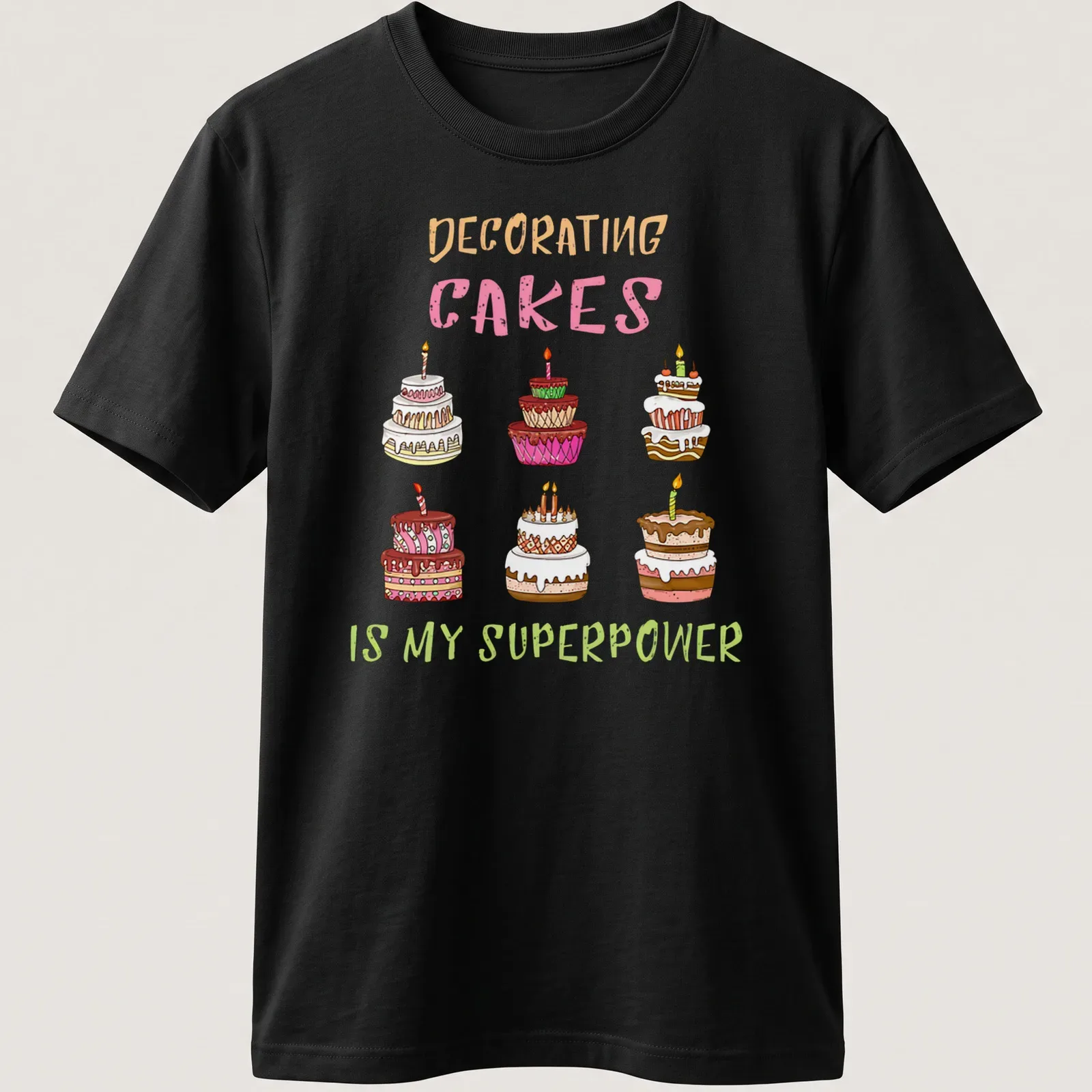 Kawaii line-art T-shirt with colorful decorated cakes and text about cake decorating. — printed on a unisex t-shirt