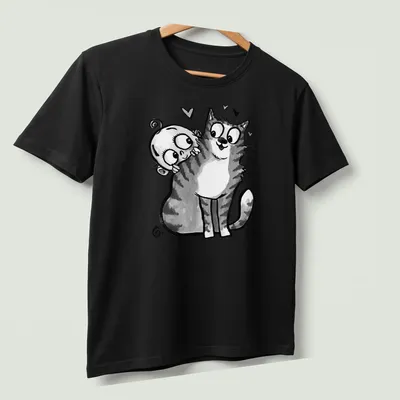 Kawaii line-art depicting a baby reaching for a curious cat with the text 'Baby Meets Cat' — printed on a unisex t-shirt (angled view)