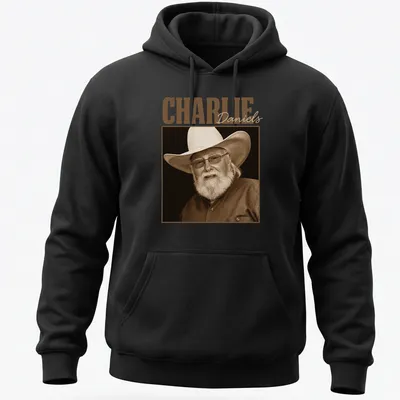 Sepia portrait of Charlie Daniels with text below in classic font — printed on a unisex hoodie