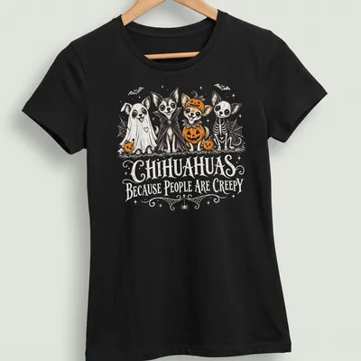 Whimsical illustration of Chihuahuas in Halloween costumes with playful text — printed on a women's shirt