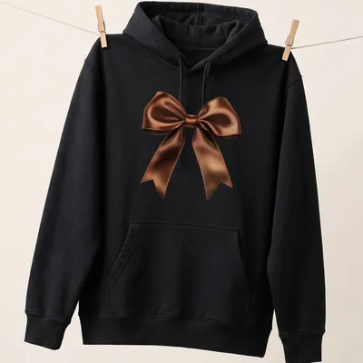 Realistic brown satin bow graphic on a — printed on a unisex hoodie