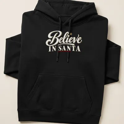 Vintage script Christmas shirt with Believe IN SANTA text in white, gold, red, and black. — printed on a unisex hoodie