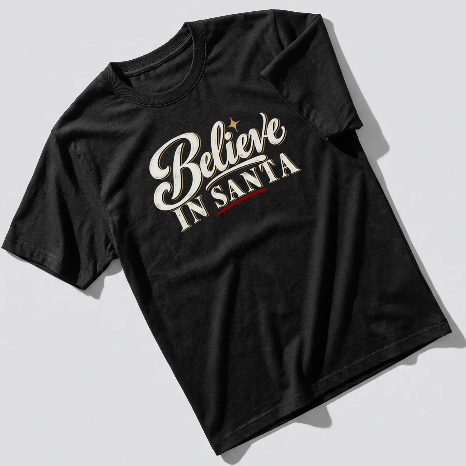 Vintage script Christmas shirt with Believe IN SANTA text in white, gold, red, and black. — printed on a unisex t-shirt