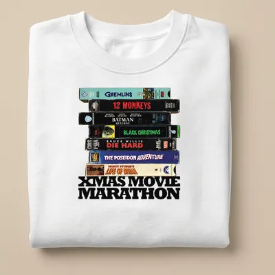 Retro design featuring VHS tapes and Xmas Movie Marathon text. — printed on a unisex sweatshirt