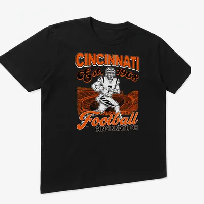 Vintage retro Cincinnati Football t-shirt featuring a player and established year — printed on a unisex t-shirt (angled view)