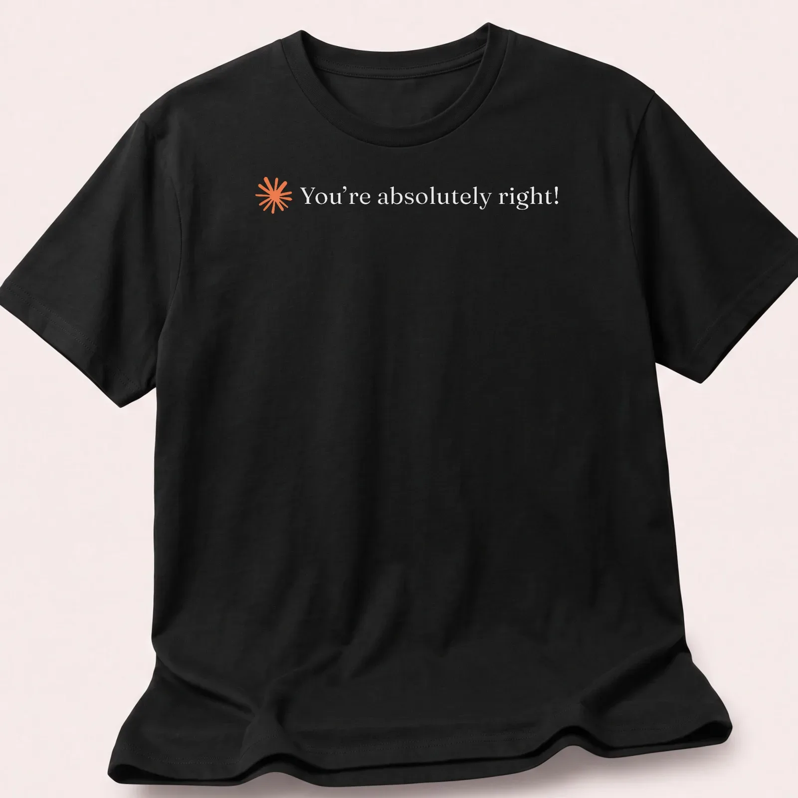 Minimalist tee featuring the text You're absolutely right! in orange on white. — printed on a unisex t-shirt