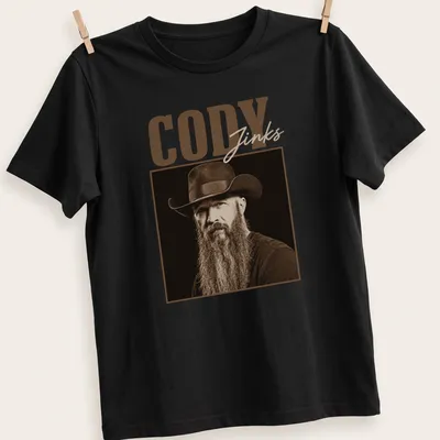 Vintage sepia portrait of Cody Jinks in cowboy hat with text