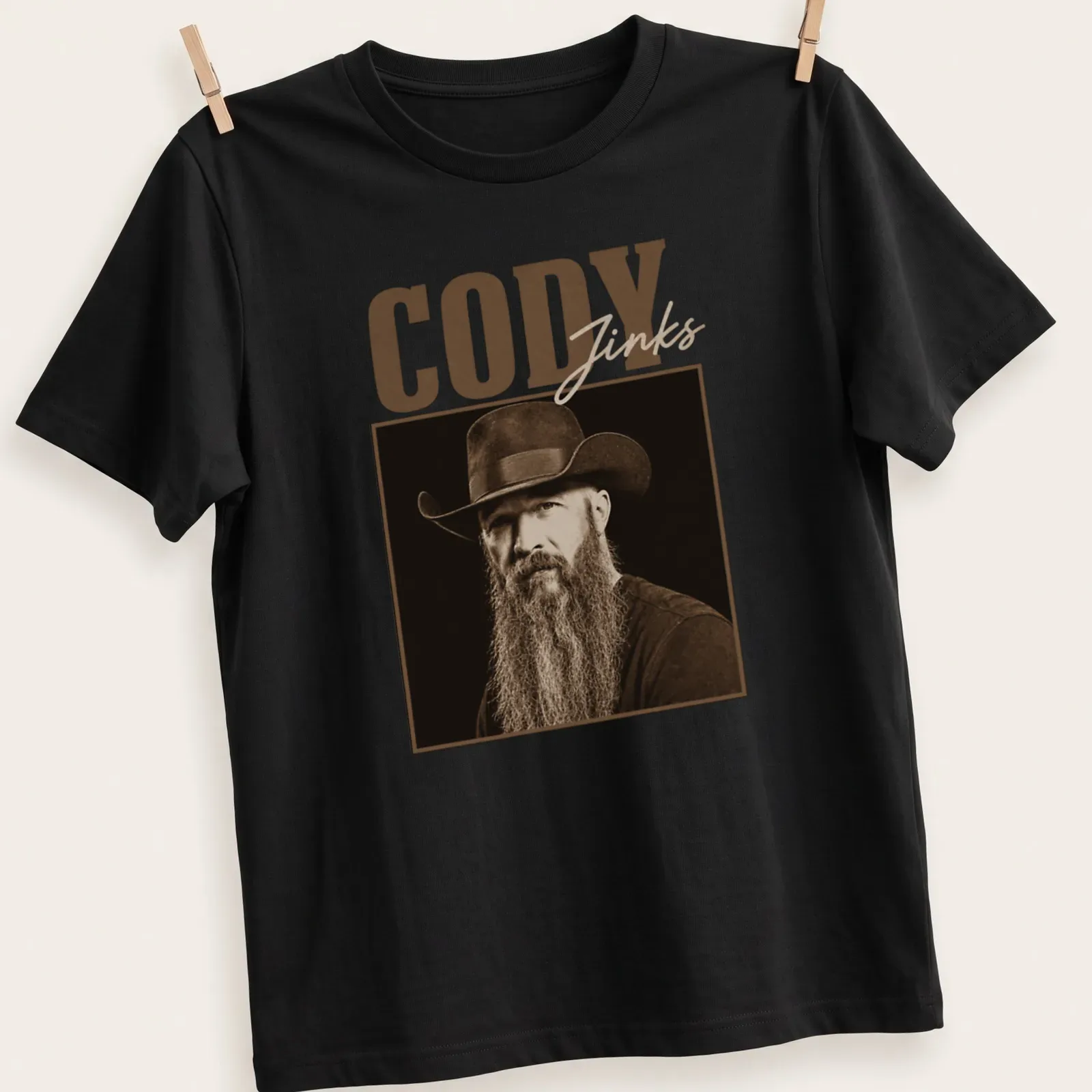 Vintage sepia portrait of Cody Jinks in cowboy hat with text — printed on a unisex t-shirt