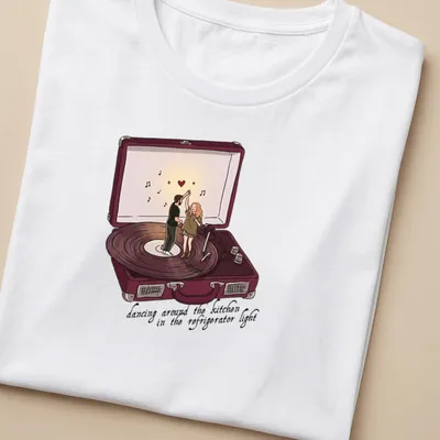Couple dancing in a kitchen, surrounded by refrigerator light, cartoon style — printed on a women's shirt
