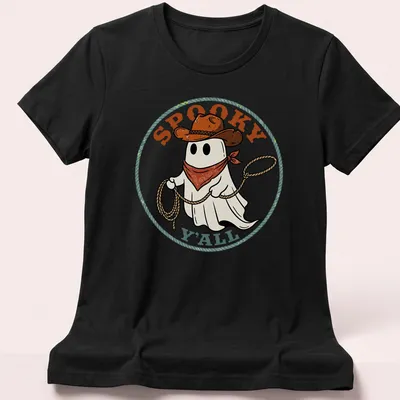 Cartoon cowboy ghost with lasso and spooky text in vibrant colors — printed on a women's shirt