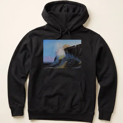 Realistic print of crashing waves against a rocky shore in blue and brown tones — printed on a unisex hoodie
