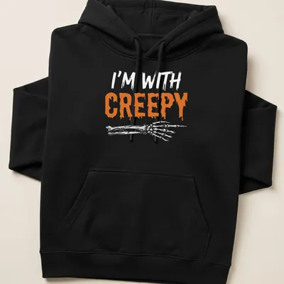 Orange and white design featuring a skeleton with the text I'm With Creepy — printed on a unisex hoodie