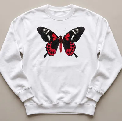 Realistic print of a Crimson Rose Butterfly on a black background with red and white details. — printed on a unisex sweatshirt