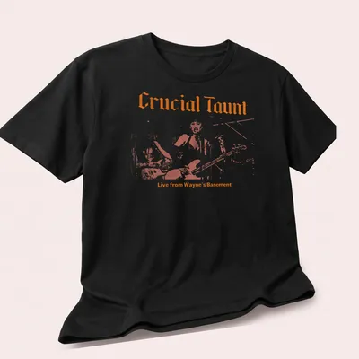 Retro T-shirt featuring the text 'Crucial Taunt Live from Wayne's Basement' in orange and white. — printed on a unisex t-shirt (angled view)