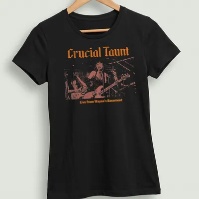 Retro T-shirt featuring the text 'Crucial Taunt Live from Wayne's Basement' in orange and white. — printed on a women's shirt