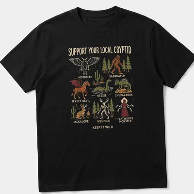 Vintage illustration t-shirt featuring cryptid monsters in various colors and bold text