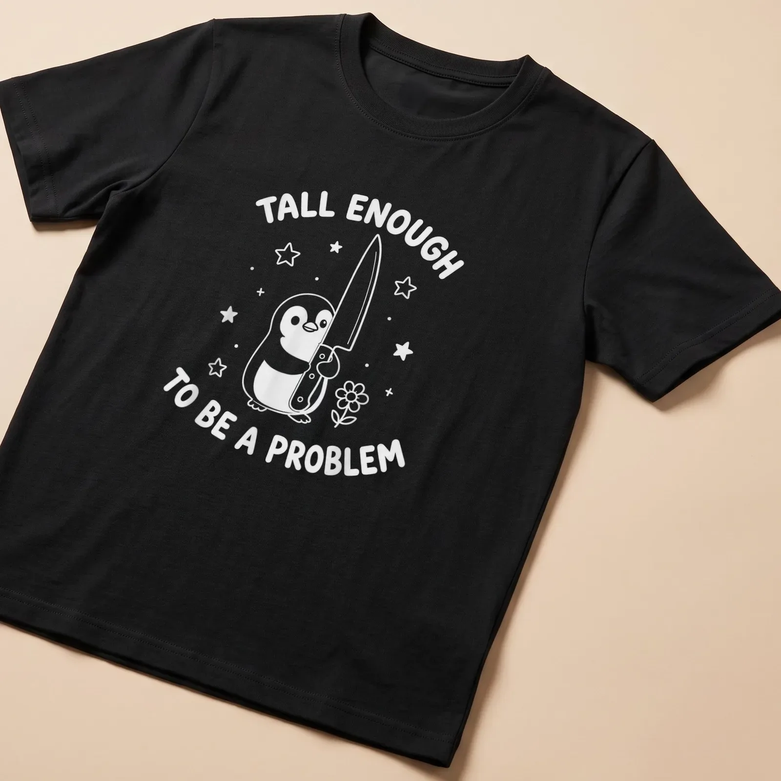 Kawaii line-art penguin holding a knife with humorous text about height. — printed on a unisex t-shirt