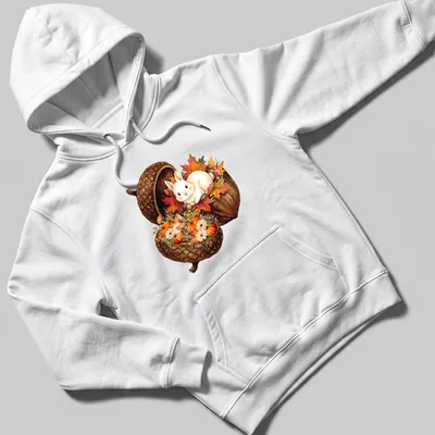 Watercolor bunny sitting in an acorn with surrounded pumpkins in autumn colors — printed on a unisex hoodie