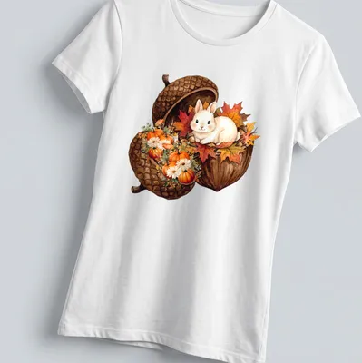Watercolor bunny sitting in an acorn with surrounded pumpkins in autumn colors — printed on a women's shirt