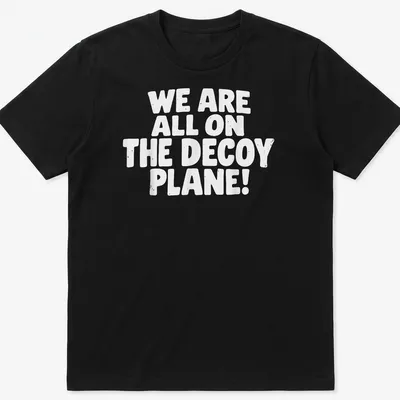 Bold typography shirt saying 'WE ARE ALL ON THE DECoy PLANE!' in white