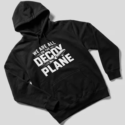 Bold typography shirt with the phrase We Are All On The Decoy Plane in white and black — printed on a unisex hoodie
