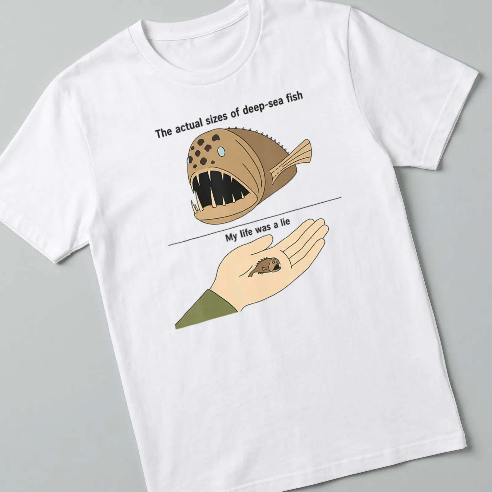 Cartoon design featuring humorous deep-sea fish sizes with printed text. — printed on a unisex t-shirt
