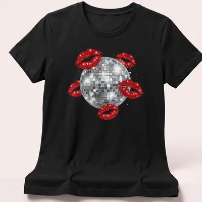 Illustration of a disco ball above red kissing lips in a glittery style. — printed on a women's shirt