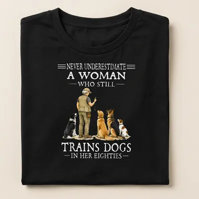 Realistic illustration of a woman training dogs with motivational text — printed on a women's shirt