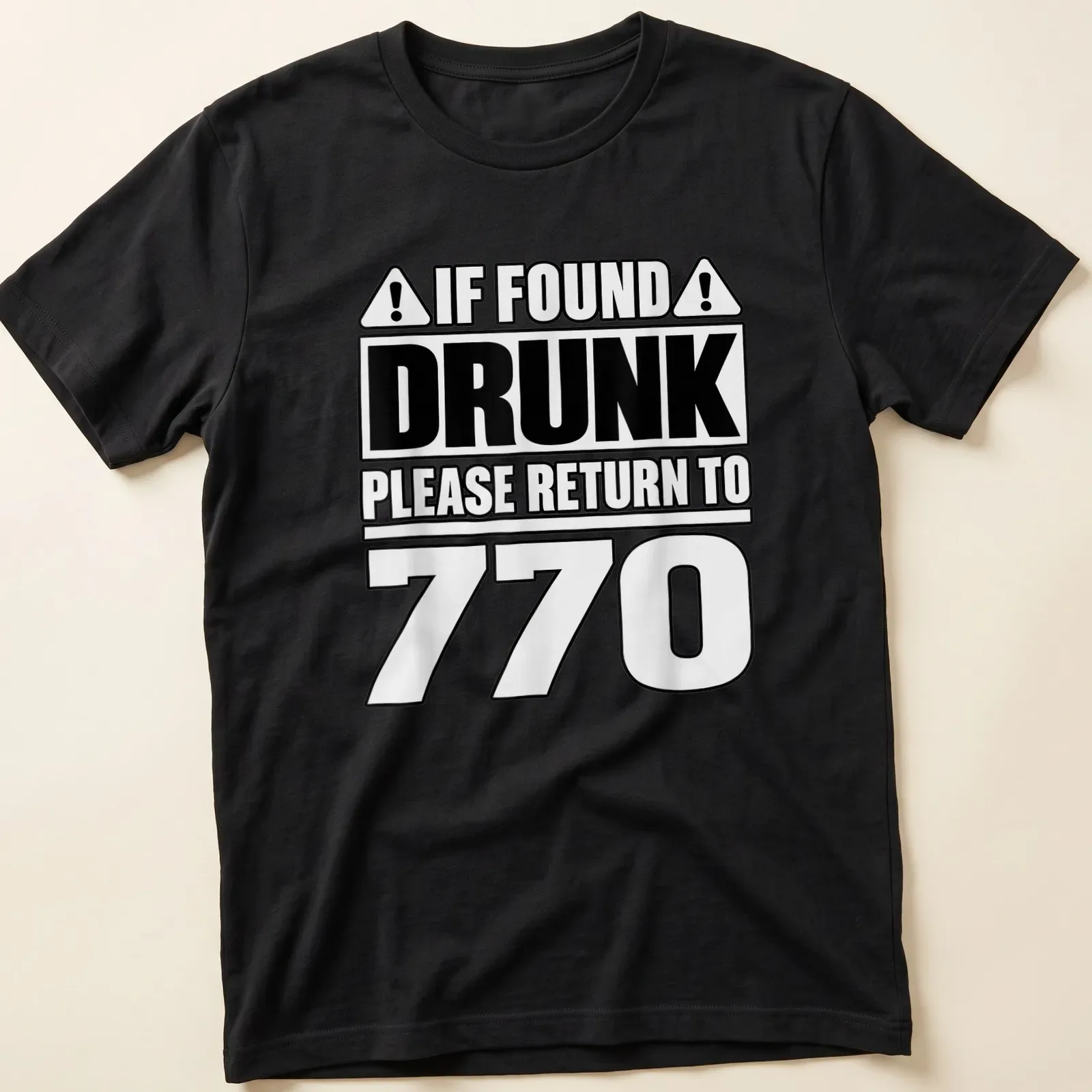 Bold typographic design reading 'If Found Drunk Please Return To 770' in black and white. — printed on a unisex t-shirt
